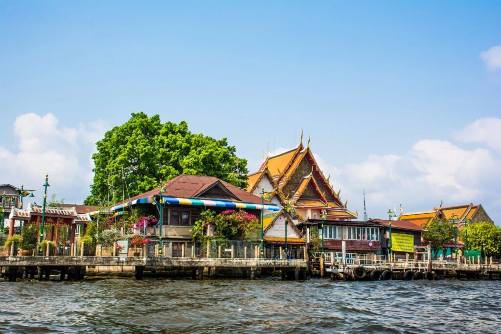 Thonburi by the river, with traditional architecture and a lot of plants