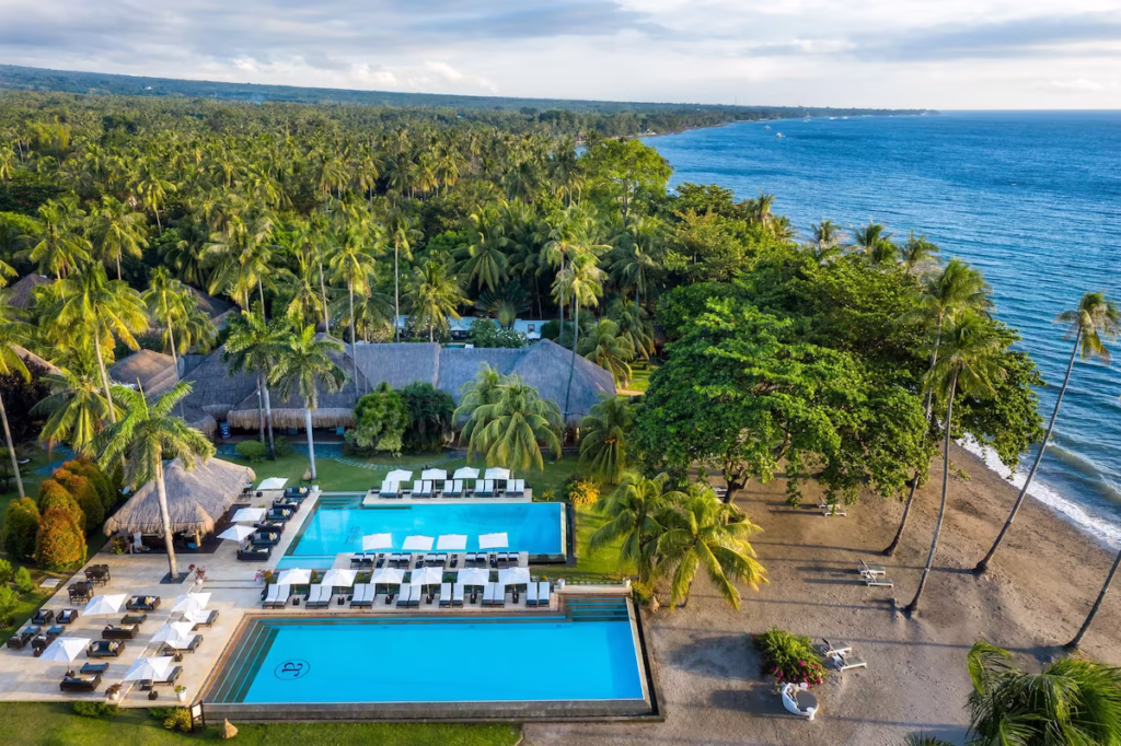 Aerial view of the pools at Atmosphere Resorts & Spa and the beach
