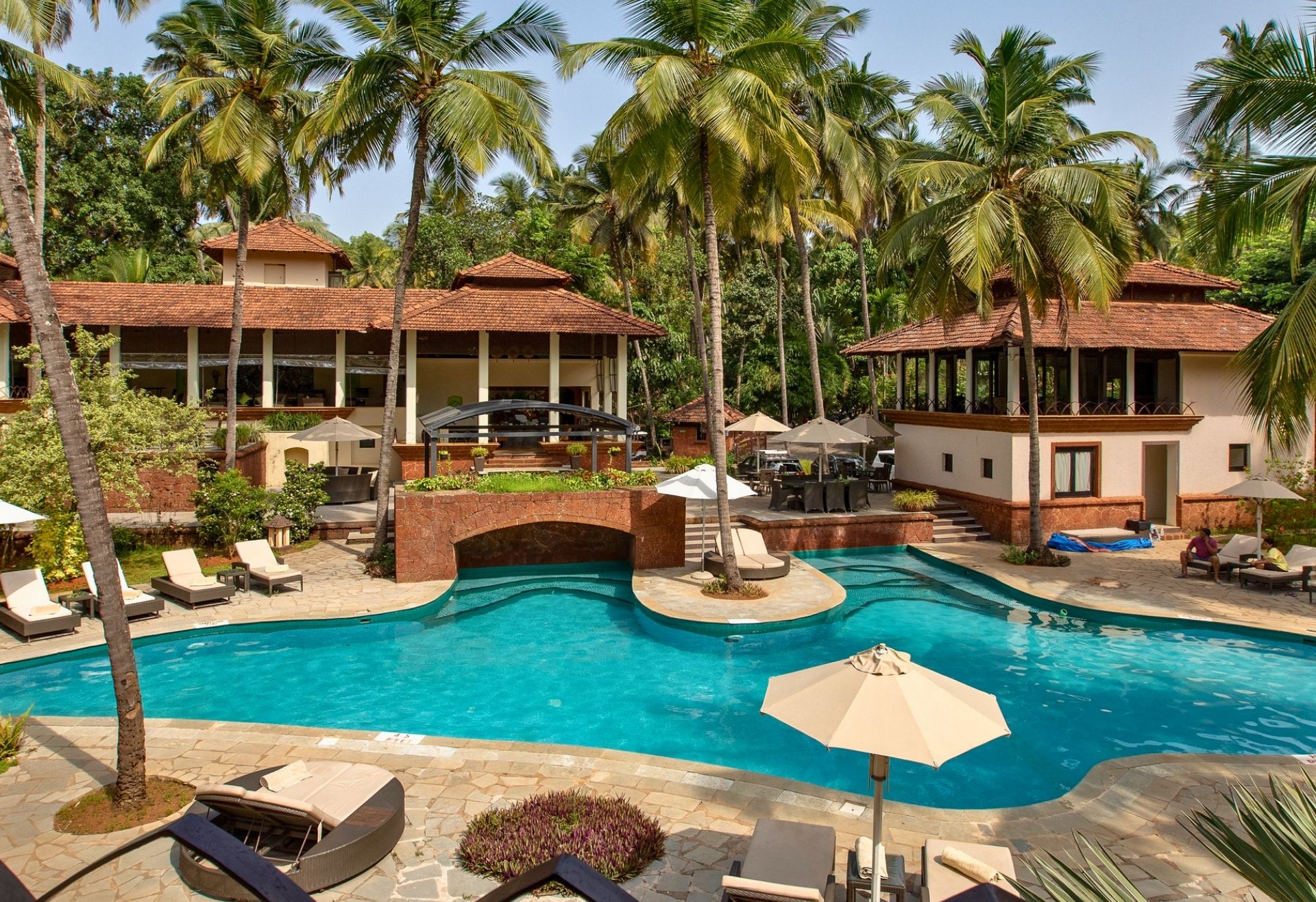 Where To Stay For a Soft Landing In India 22 large pool at Coconut Creek Resort surrounded by palm trees