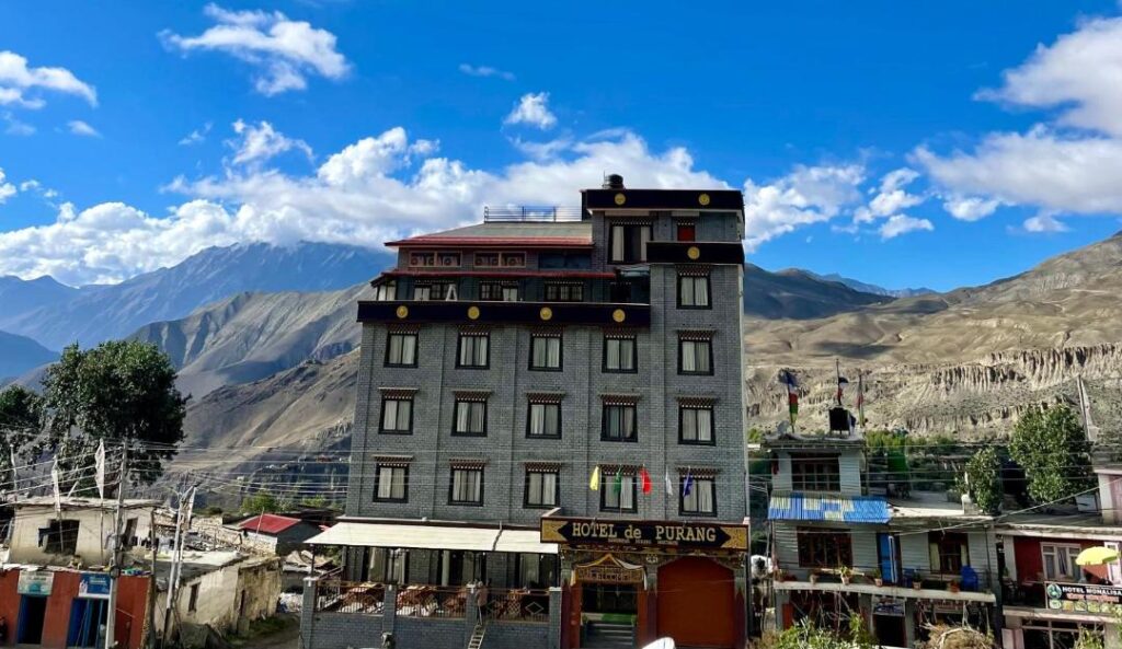 Street View Of Hotel De Purang Muktinath And The Mountains During The Day