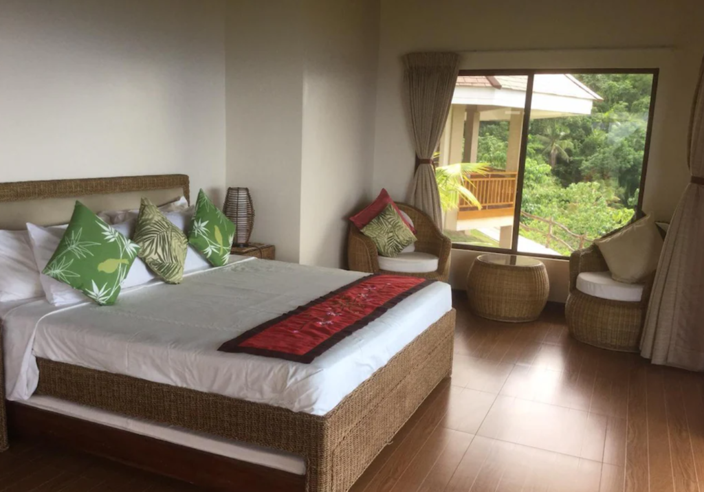Infinity Heights Resort, room with natural woven furnishings and garden views
