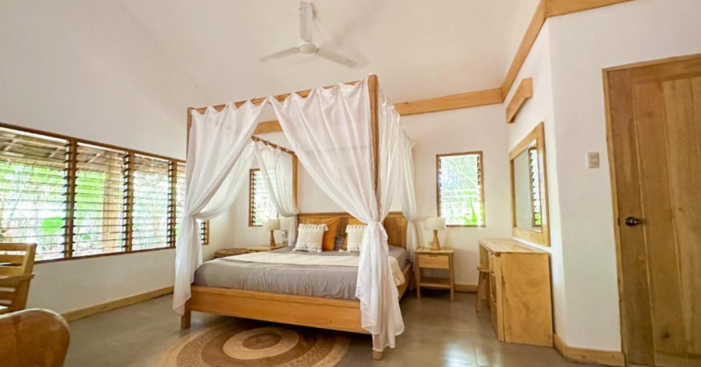 Mandala Tribe Treehouses, room with a canopy bed and garden views
