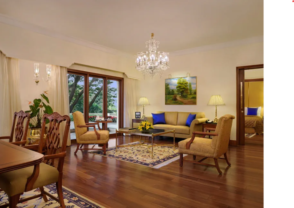 Where To Stay For a Soft Landing In India 26 The Oberoi Bengaluru, suite with a living room, chandelier, and patio