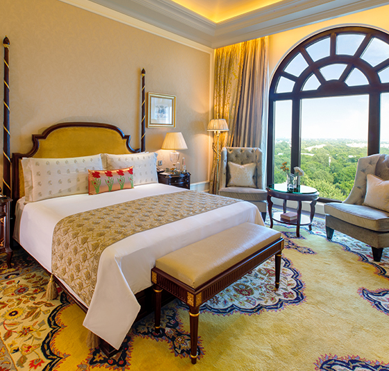 Where To Stay For a Soft Landing In India 2 The Leela Palace New Delhi, room with a traditional carpet and an arch window with park view
