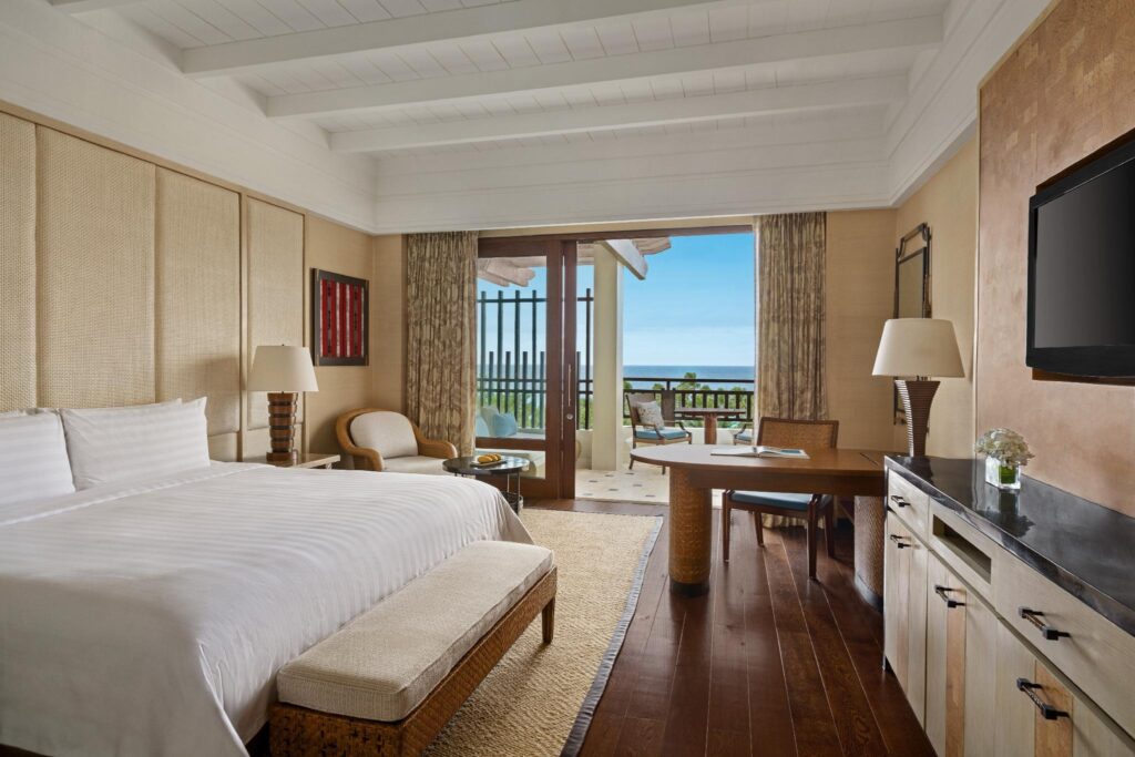 Shangri-La Boracay, room with wood flooring and a patio overlooking the sea