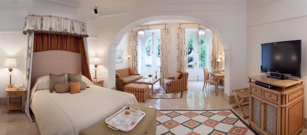 Where To Stay For a Soft Landing In India 30 Taj Falaknuma Palace, Hyderabad, room with artistic tile flooring and a separate lounge area