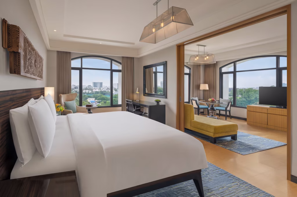 Where To Stay For a Soft Landing In India 36 The Raintree, suite with a separate living room and large windows with city views