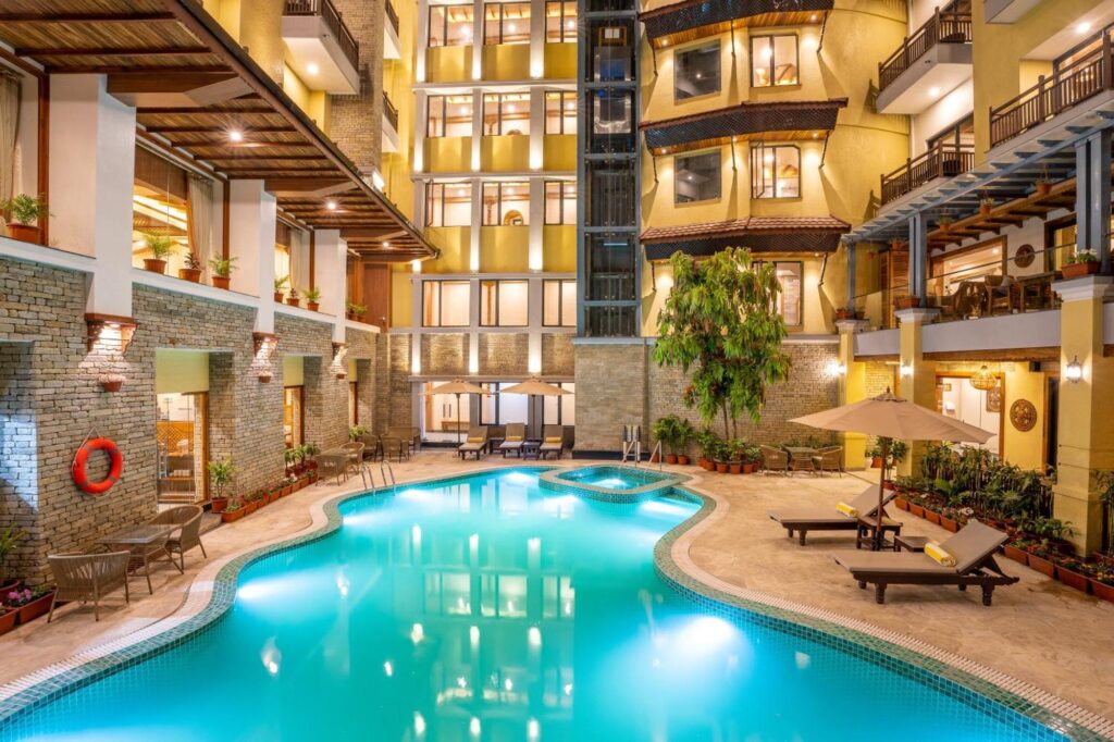 Temple Bell Boutique Hotel & Spa, View Of The Pool Lit Up At Night