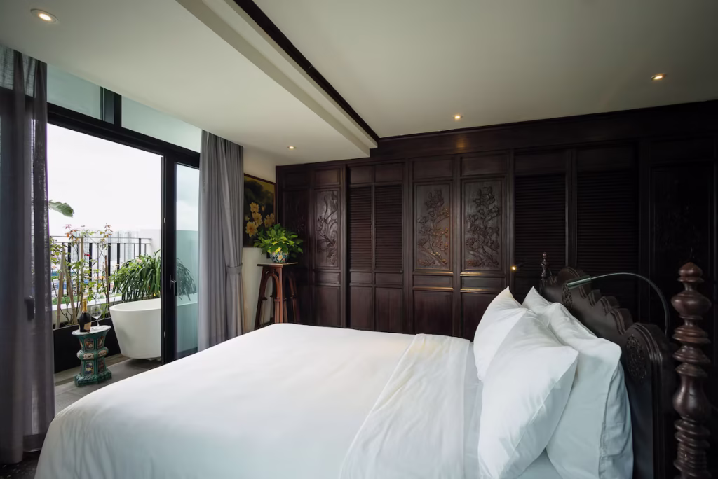 Where To Stay In Ho Chi Minh City 18 Amanaki Thao Dien, A Nice Dark Wood Room With A Bathtub With A City View