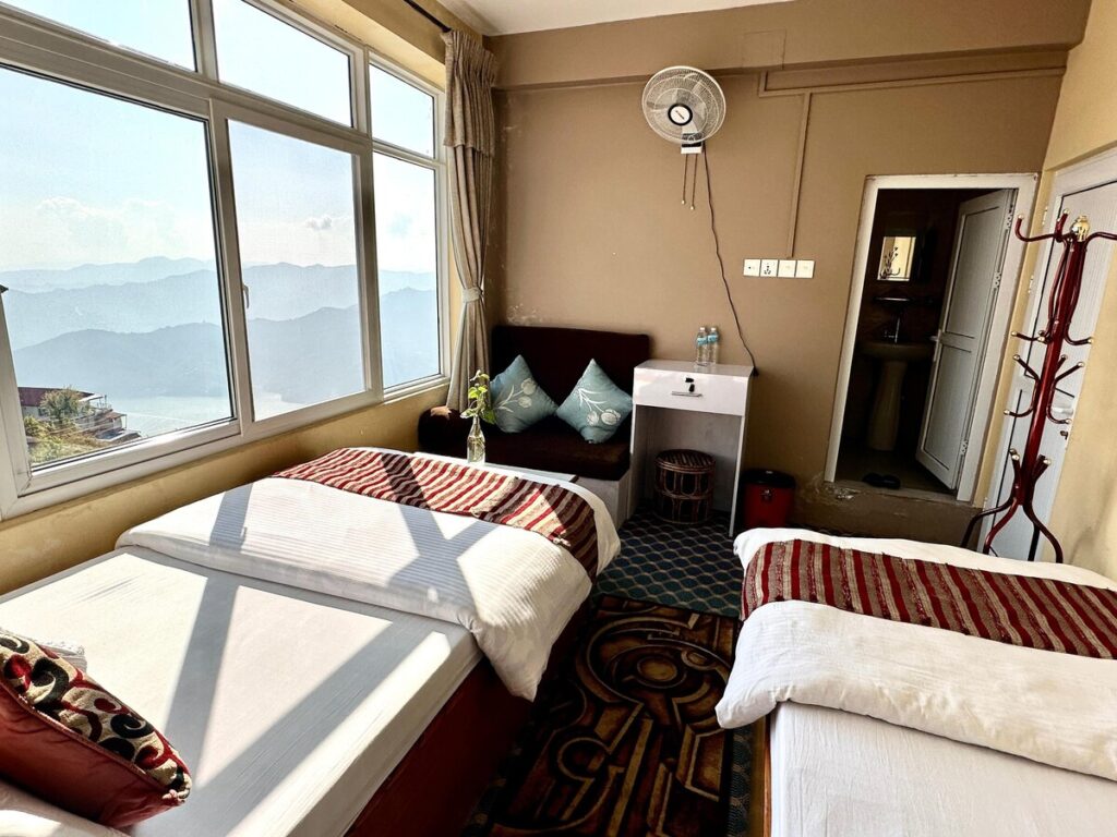 High Ground Inn & Rooftop Restaurant, Room With Large Windows Overlooking The Mountains And Lake