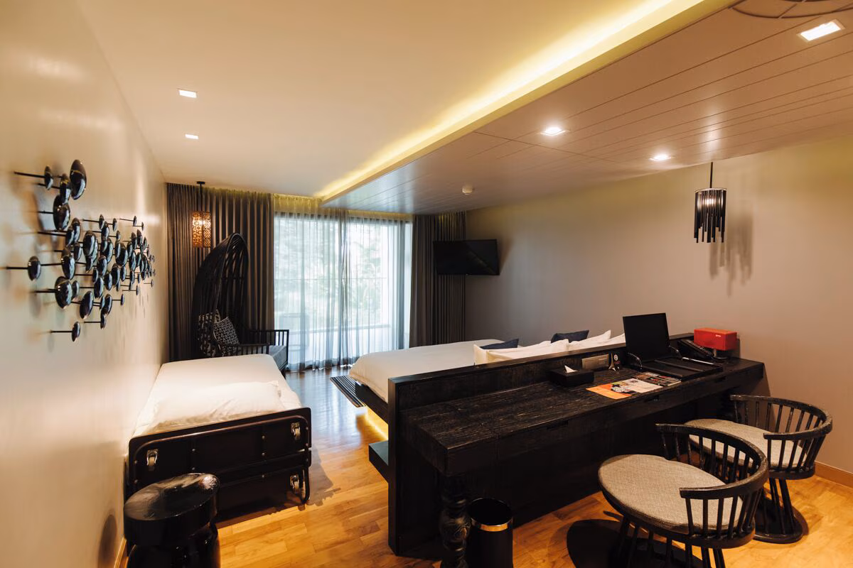 Cross Chiang Mai Riverside, room with work desk and river views