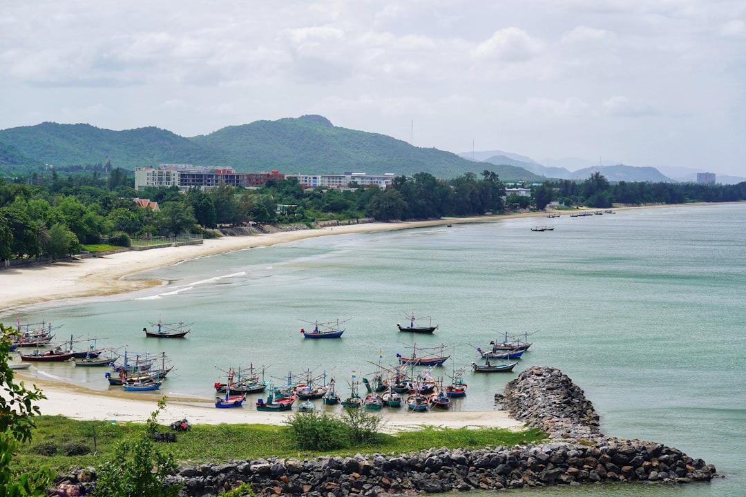Hua Hin beach with traditional Thai fishing boats