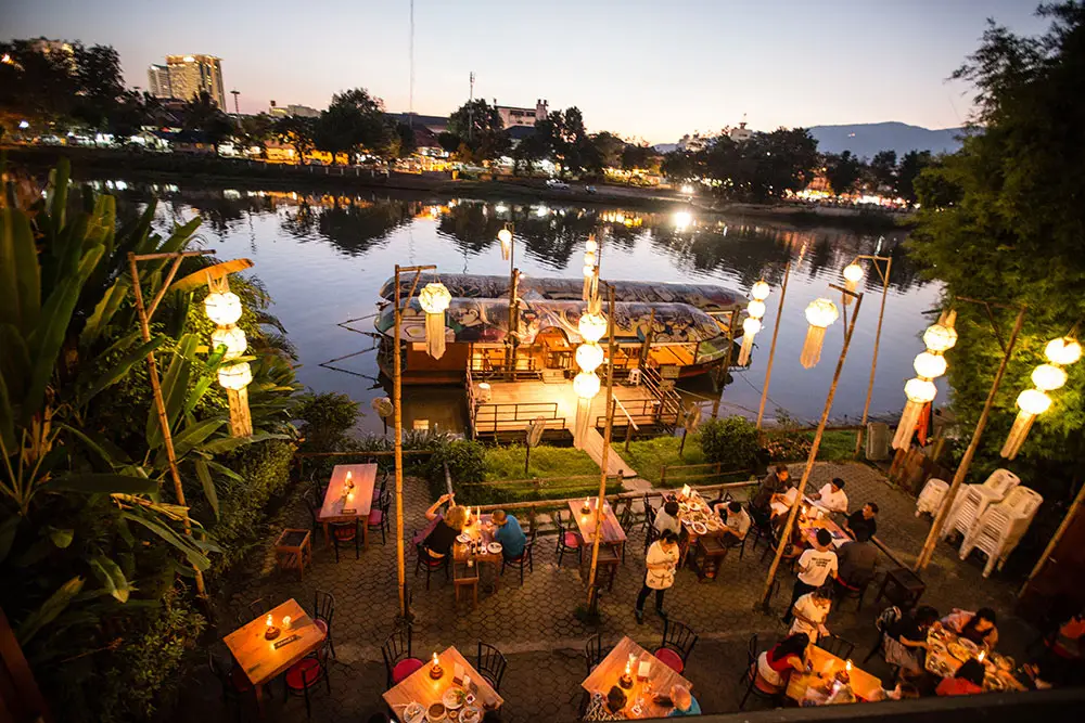 Dinner along the Chiang Mai River at sunset