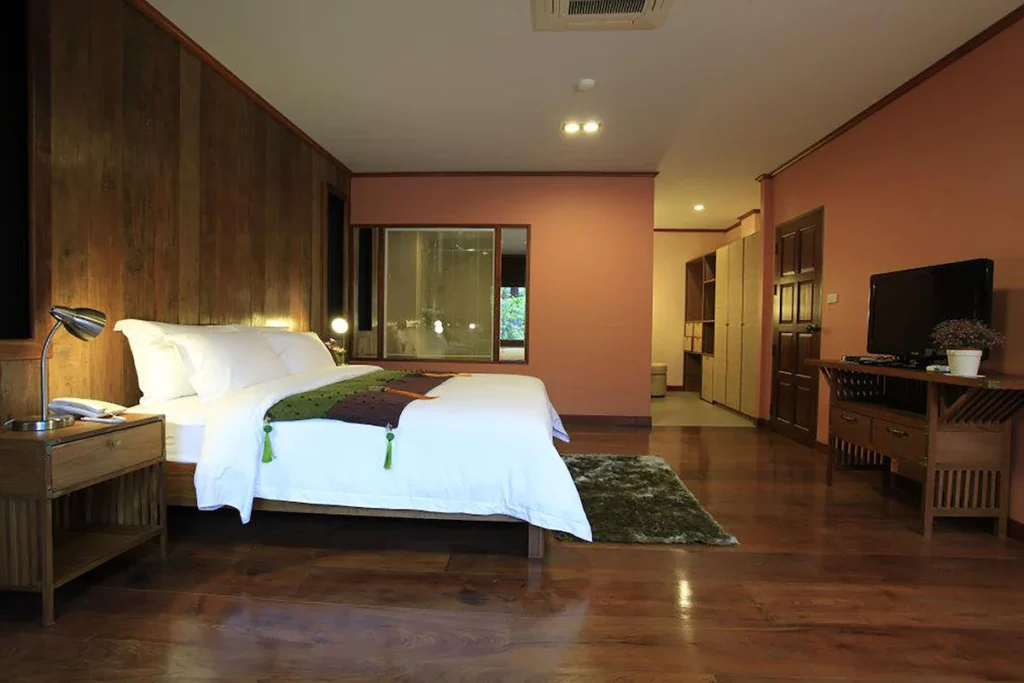 VC@Suanpaak Hotel and Serviced Apartments with fully equipped kitchen and wood accent wall