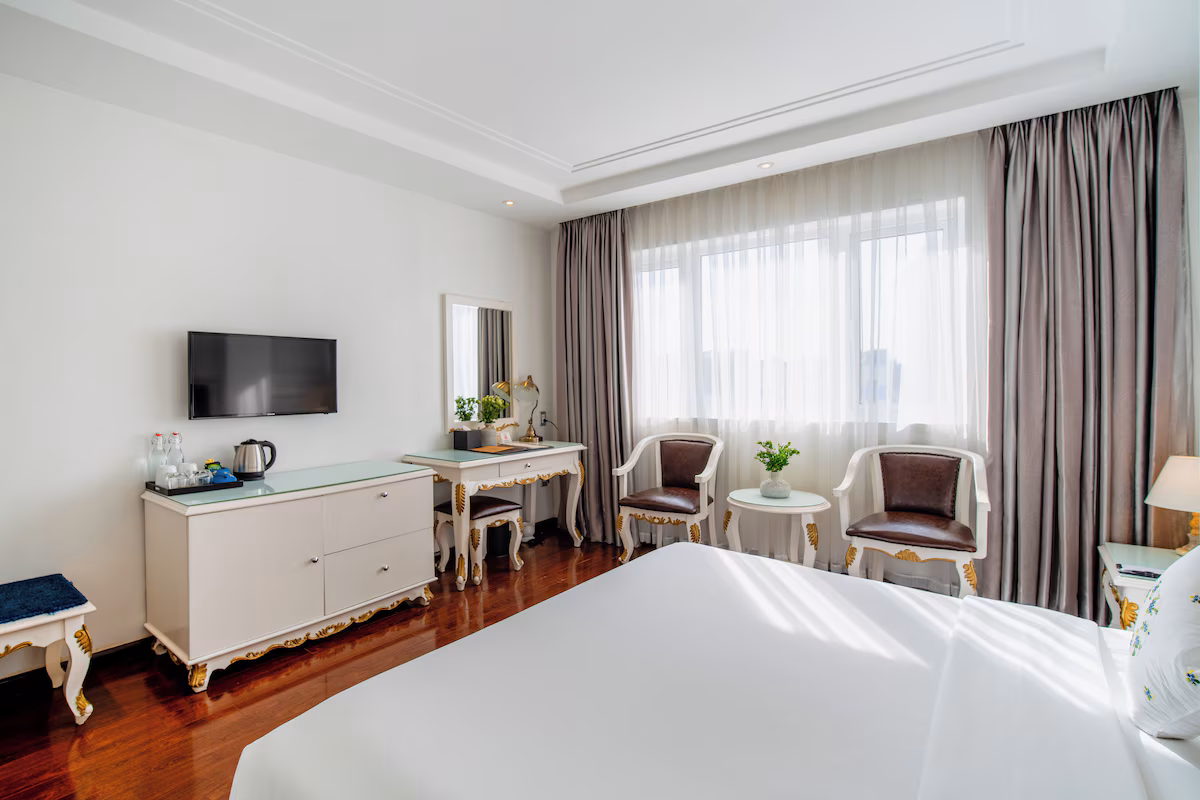 Alagon Saigon Hotel and Spa, room with natural light and sitting area
